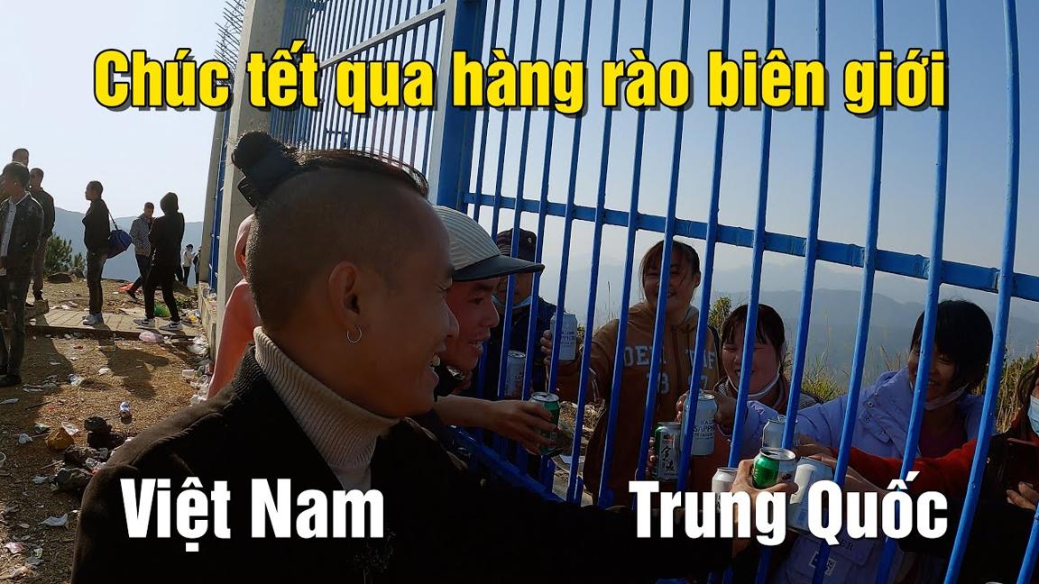 Người Việt và người Trung Quốc vui mừng nhậu qua song sắt hàng rào biên giới sau nhiều năm không gặp